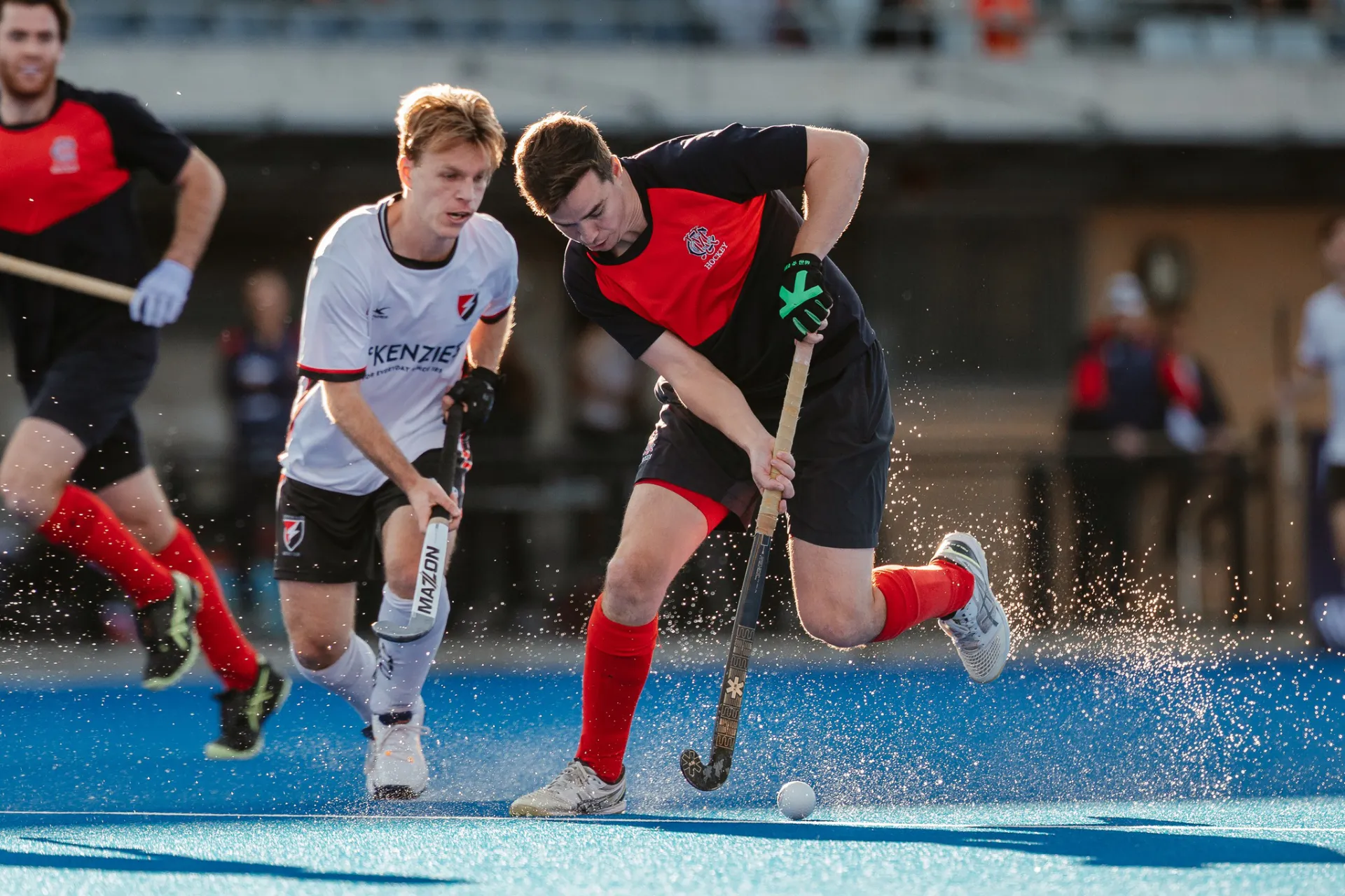 Men playing hockey