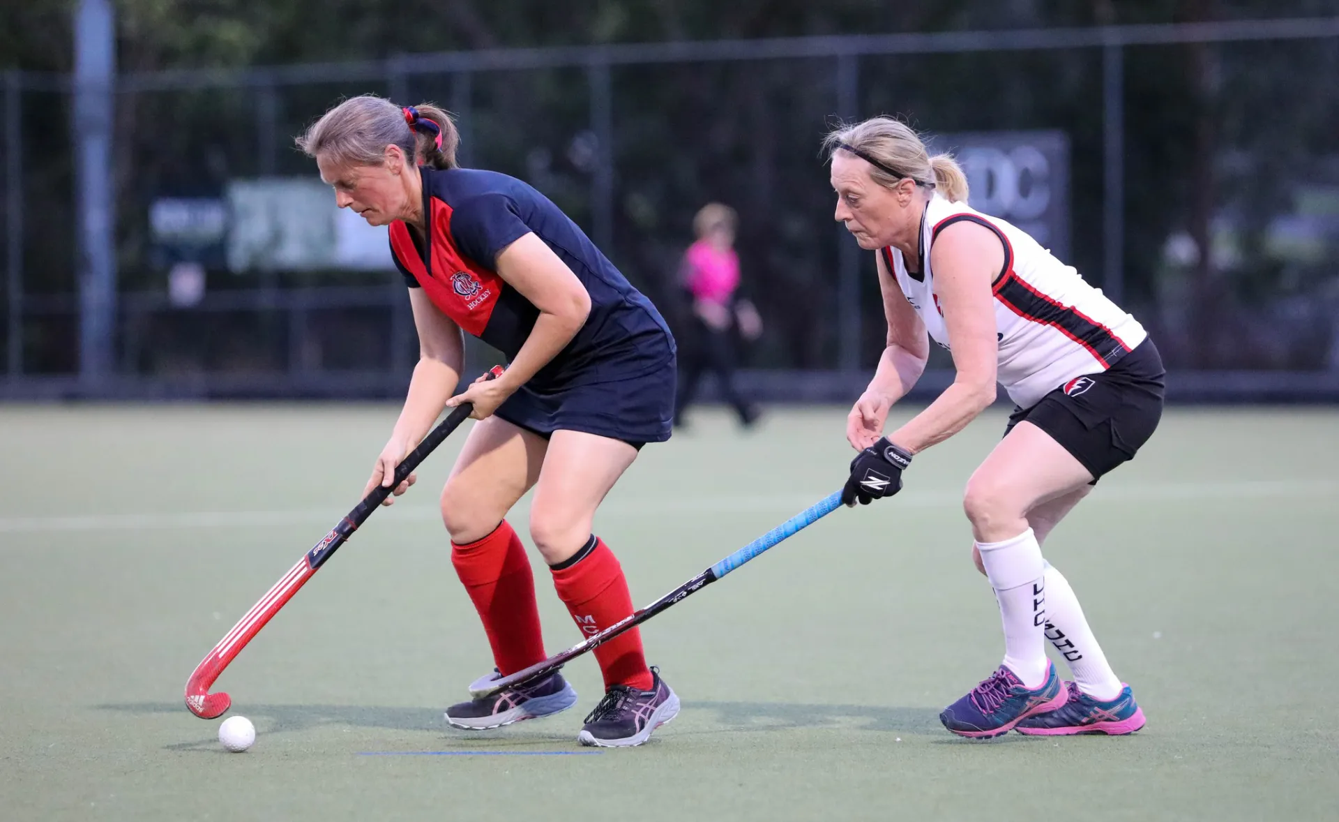 Women playing hockey